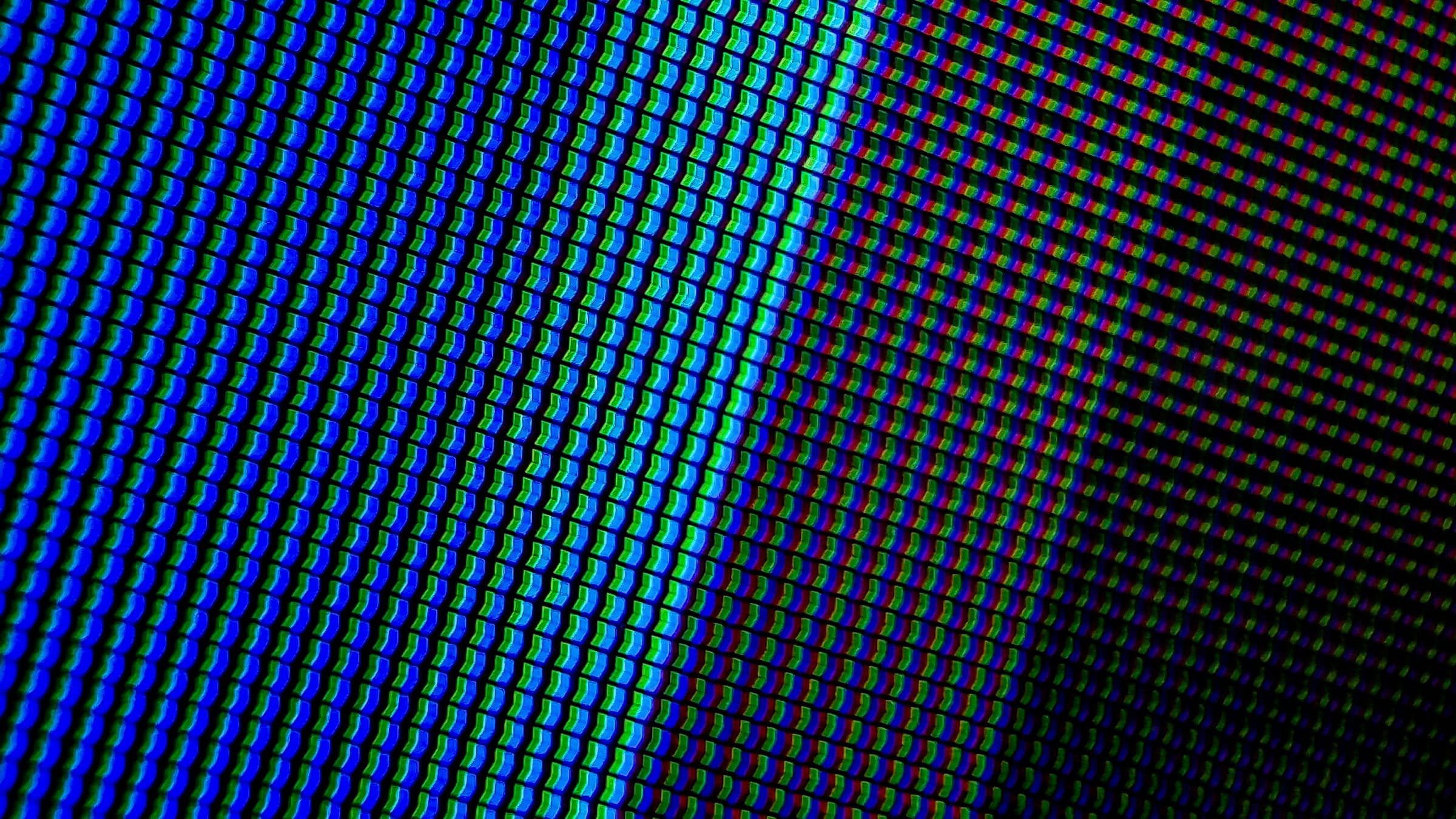 Loupe sur une grille de pixels annotée DPI et PPI